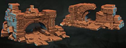 two 3D models of damaged structures, including ruins and ruins with a bridge. The structures appear to be made of a brown material and are in a state of disrepair, with broken or damaged parts.