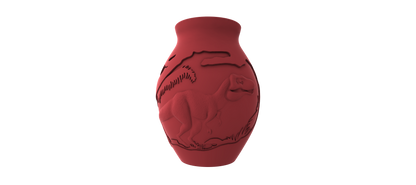 A red ceramic vase with an embossed design depicting a stylized animal, likely a dinosaur or a similar creature, against a black background.