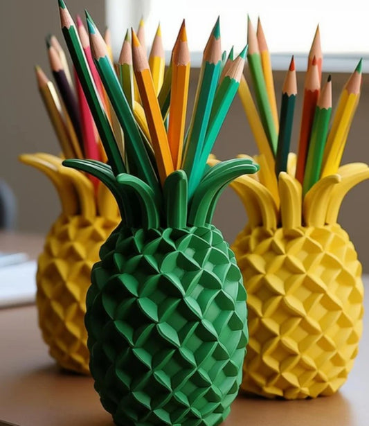 three pineapple-shaped pencil holders, each filled with a variety of colored pencils.