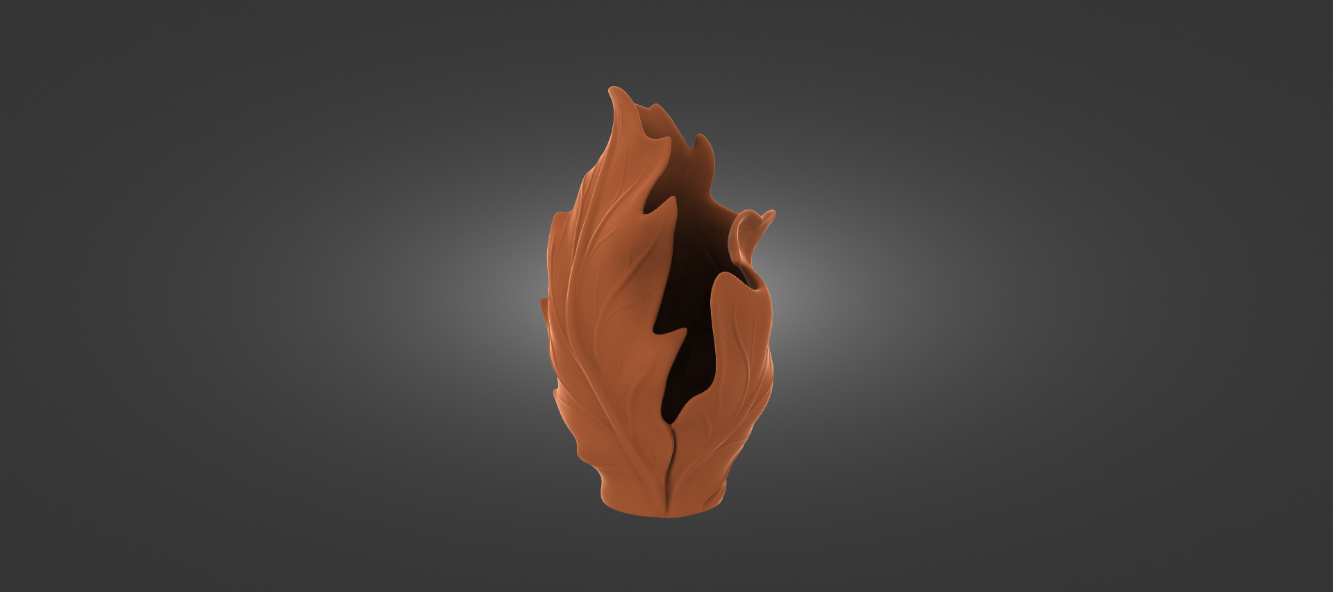 An orange, abstract sculpture resembling a flame or flower shape stands out against a dark background.