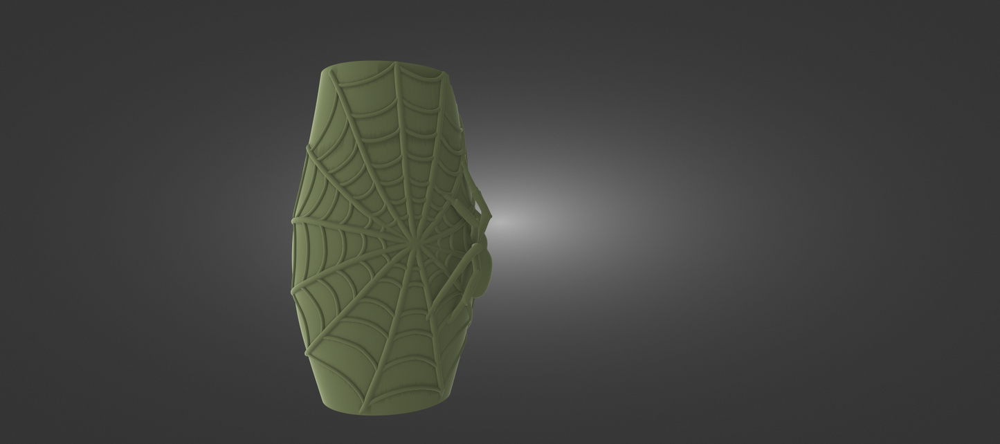 A green, spider-like object with a web-like pattern on it, set against a dark background.