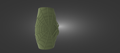 A green, spider-like object with a web-like pattern on it, set against a dark background.