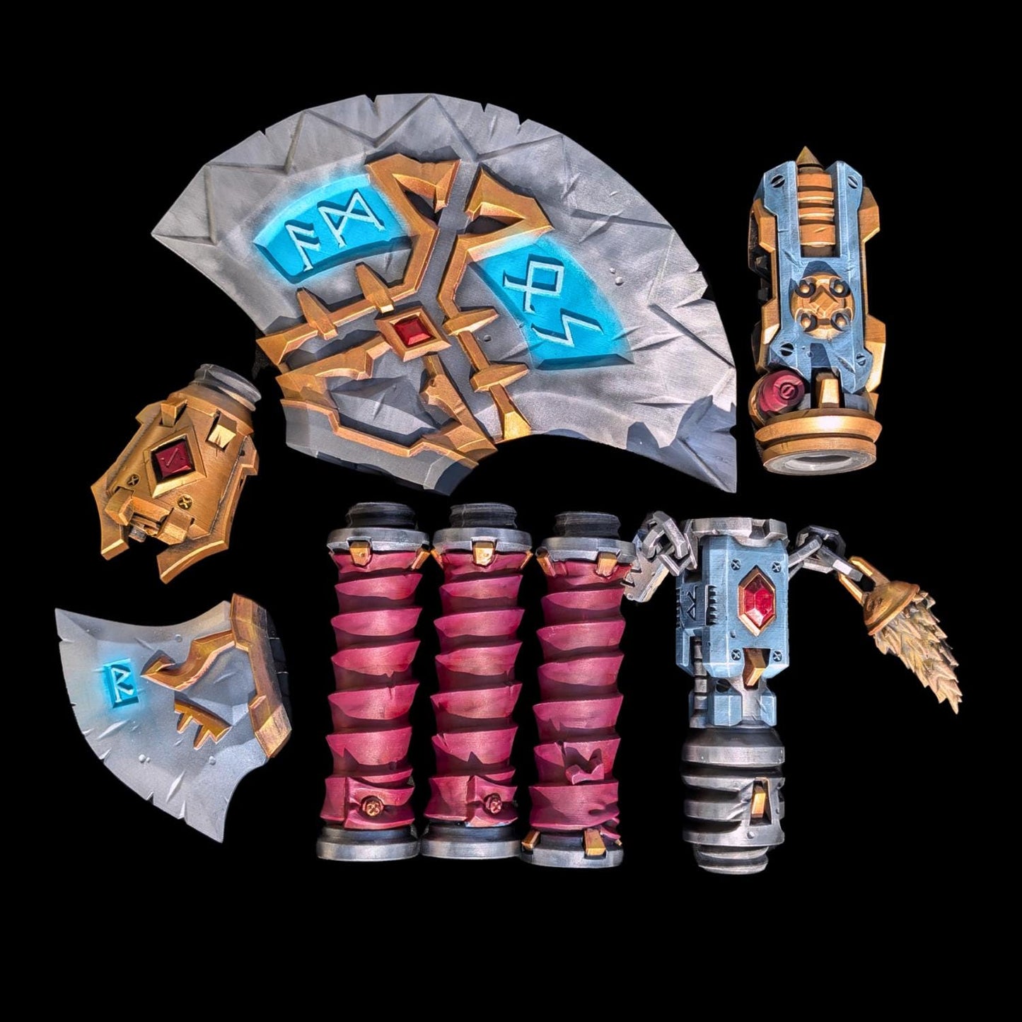 various futuristic and technological elements, including a large shield-like object with blue and gold accents, a cylindrical device with a red and gold color scheme, and several other metallic components with unique designs and patterns.