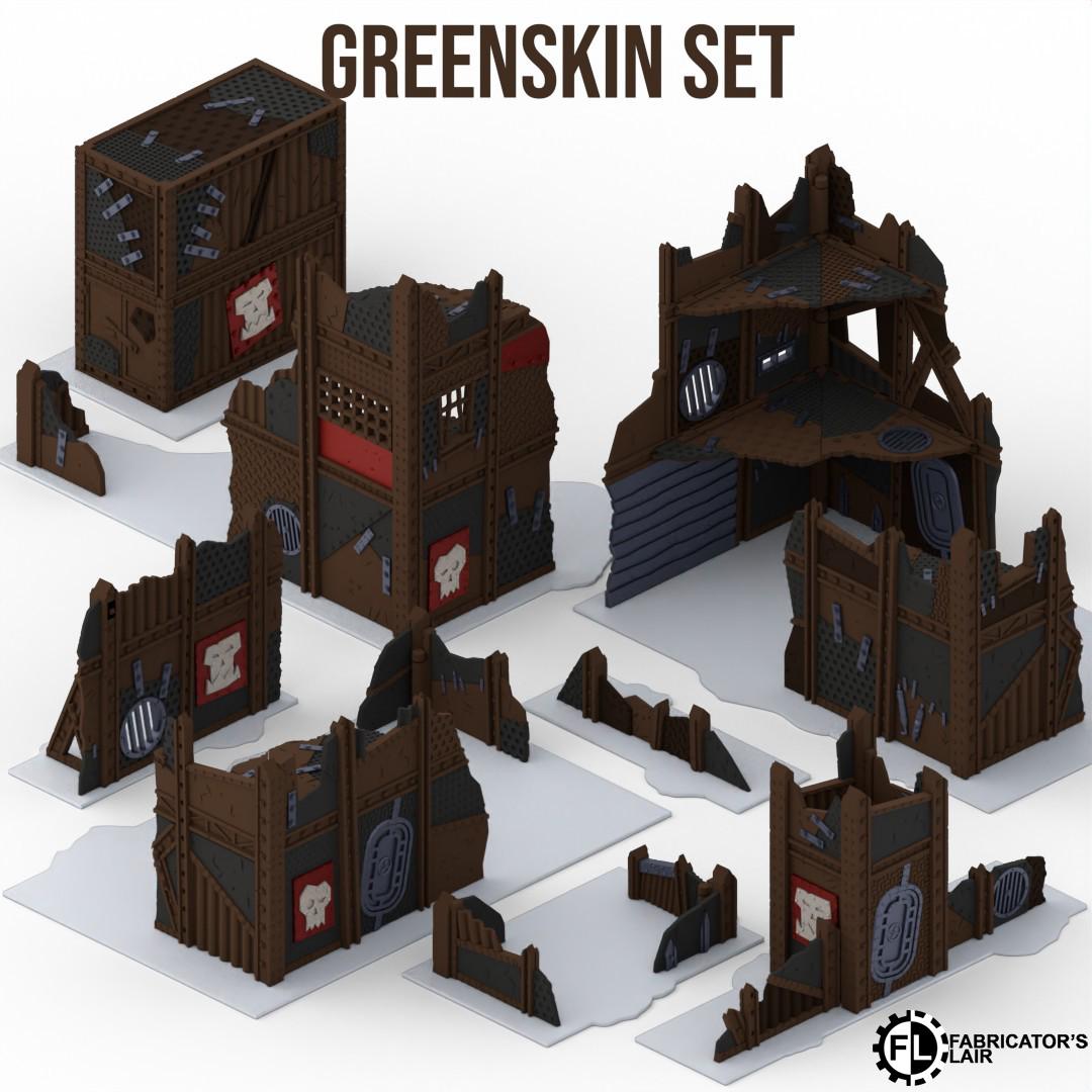 a collection of various damaged and destroyed structures, including buildings and towers, which appear to be part of a Greenskin set.