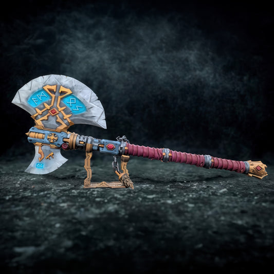 A detailed and ornate fantasy weapon, possibly a sword or axe, with intricate designs and patterns. The weapon appears to be a collectible item or a prop, displayed on a stand against a dark background.