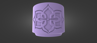 A purple, ornate object with a symmetrical design featuring a floral or geometric pattern.
