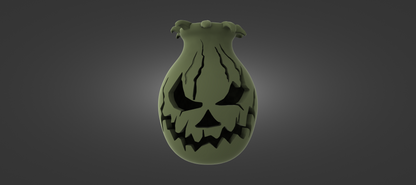 A green, spooky-looking vase with a carved face on it, set against a dark background.