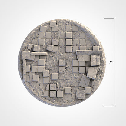 A 3D rendering of a circular object composed of numerous small square tiles or blocks, with some of the tiles appearing to be broken or cracked.