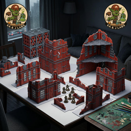 a tabletop with various tabletop games and models, including a large red and gray structure, a smaller red and gray structure, and a set of miniature figures. The setting appears to be a gaming or tabletop event, with a couch and a lamp visible in the background.