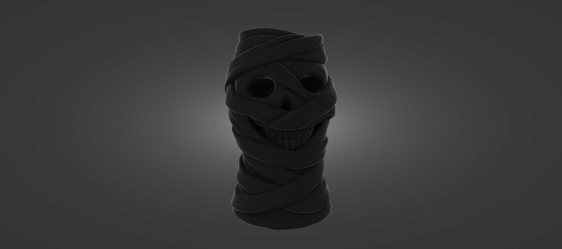 A dark, abstract sculpture resembling a skull or a mummified figure, with a twisted, coiled shape and a dark, shadowy appearance.