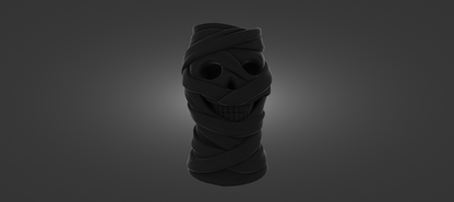 A dark, abstract sculpture resembling a skull or a mummified figure, with a twisted, coiled shape and a dark, shadowy appearance.