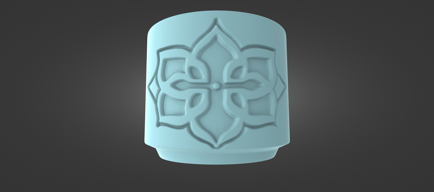 A light blue, cylindrical object with an intricate, symmetrical design on its surface, set against a dark background.