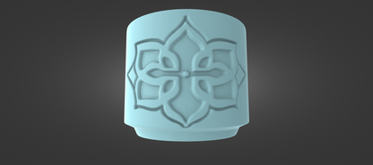 A light blue, cylindrical object with an intricate, symmetrical design on its surface, set against a dark background.