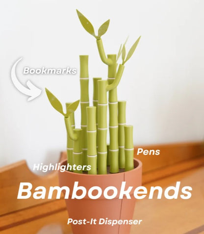 A potted bamboo plant with green leaves and stems, which appears to be a creative and eco-friendly pen holder.