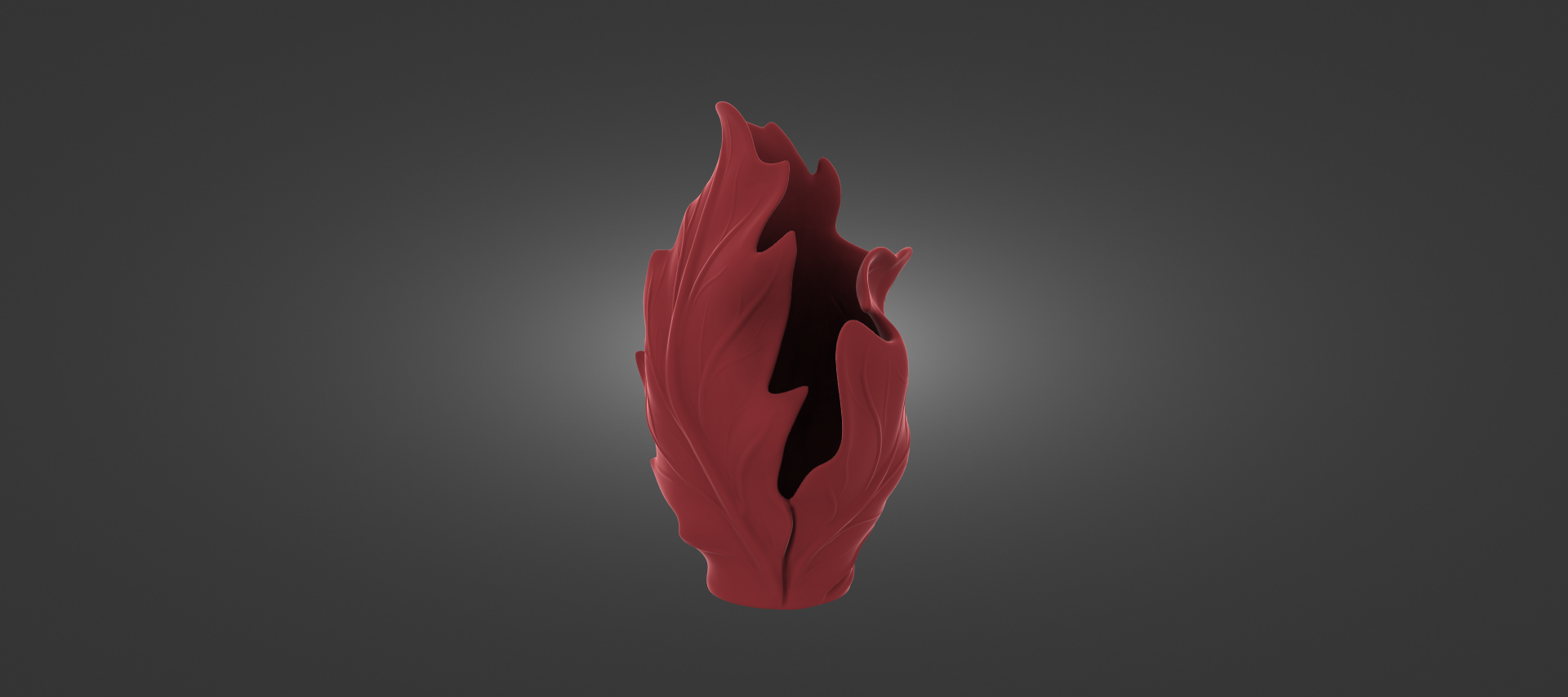 A red, abstract sculpture resembling a flower or plant stands out against a dark background.