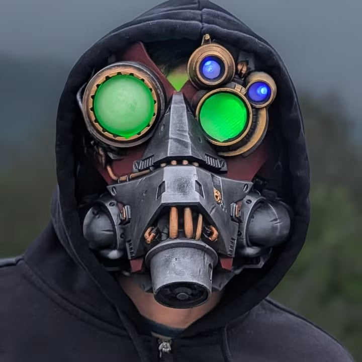 Datalink Machine Spirit Mask worn with illuminated green and blue lenses