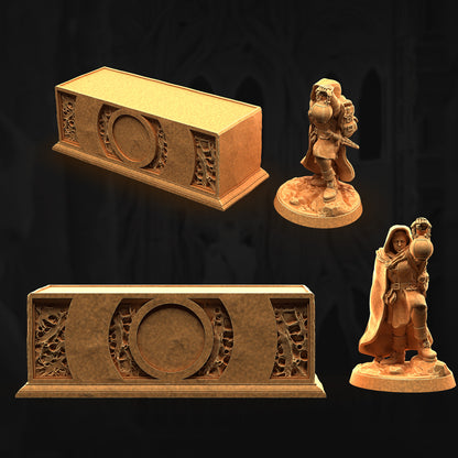 a couple of figurines that are next to a box