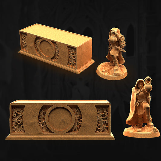 a couple of figurines that are next to a box
