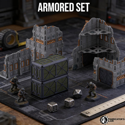 a tabletop armored set, including miniature buildings, soldiers, and various pieces of equipment, such as a large green container and two dice.